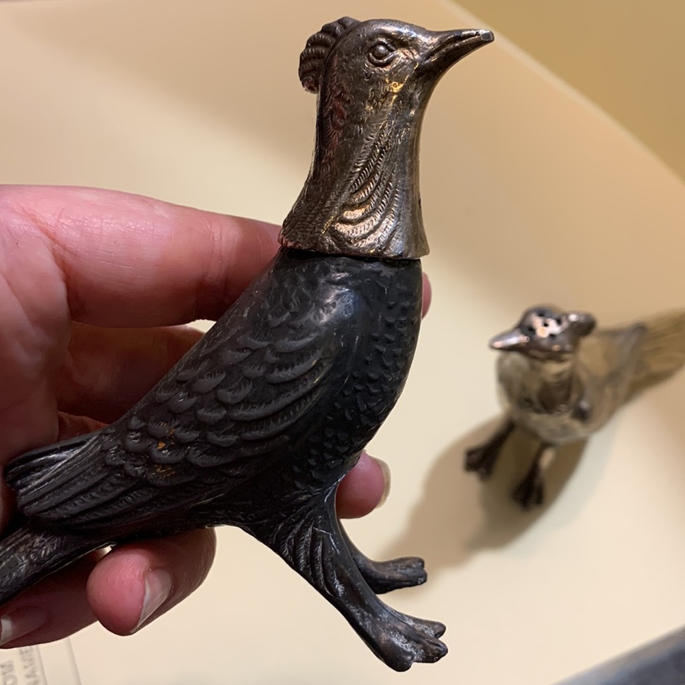 Vintage pheasant salt and pepper shakers.